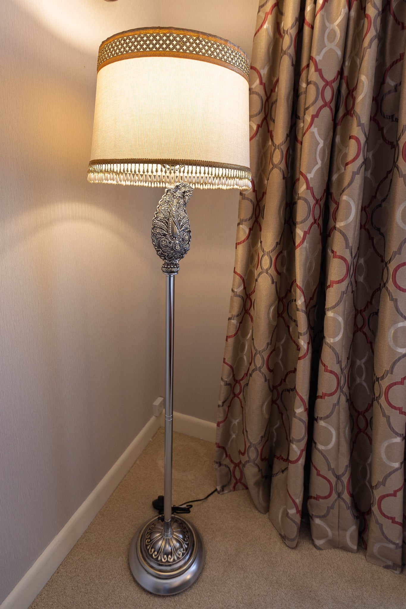 Elegant Silver Floor Lamp with Textured Shade and Ornate Detail