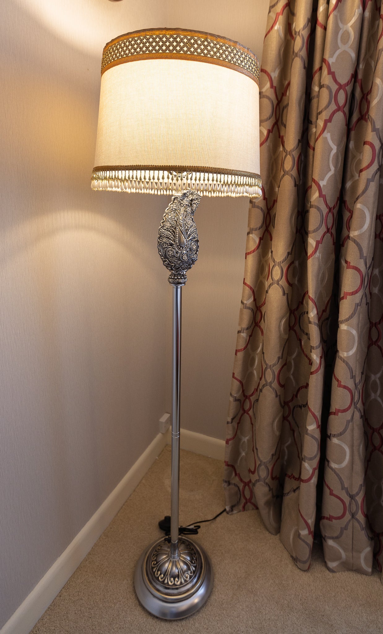 Elegant Silver Floor Lamp with Textured Shade and Ornate Detail