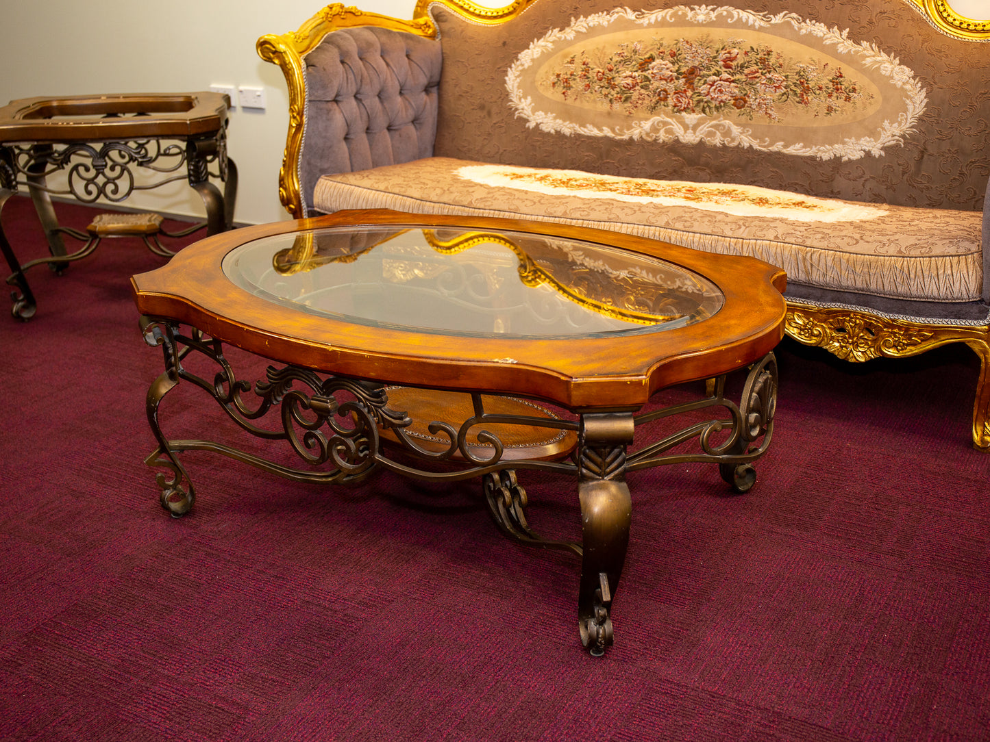 Ornate Oval Glass-Top Coffee Table with Iron Base