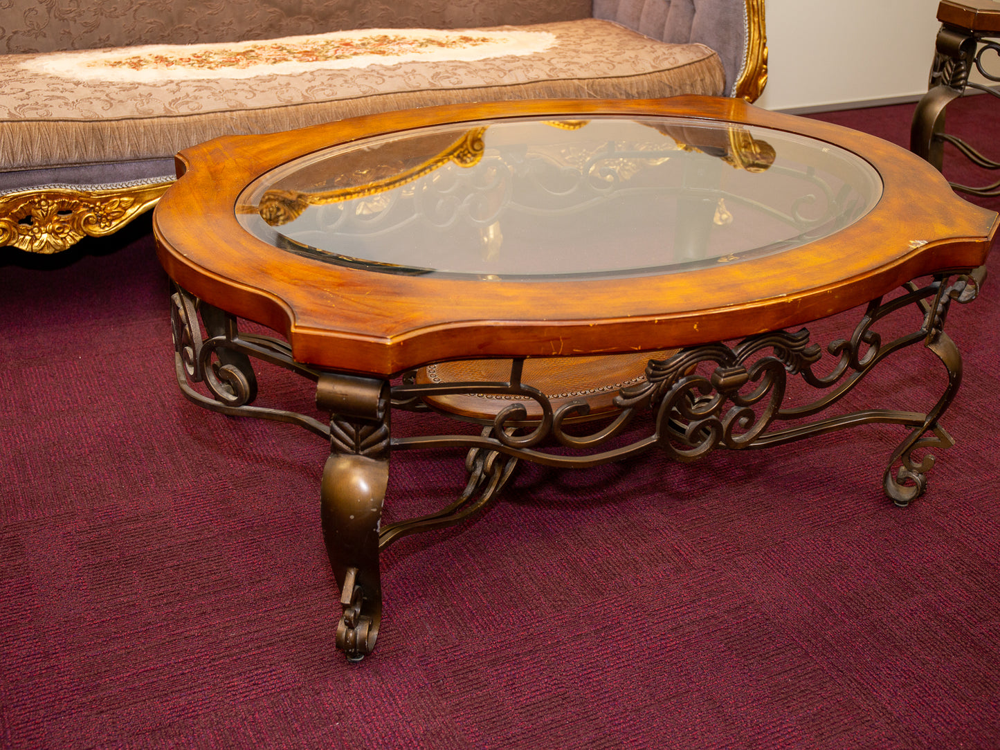 Ornate Oval Glass-Top Coffee Table with Iron Base