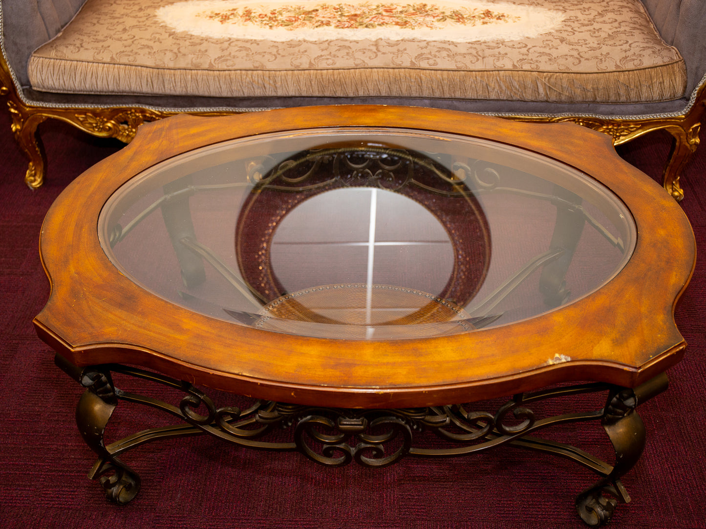 Ornate Oval Glass-Top Coffee Table with Iron Base