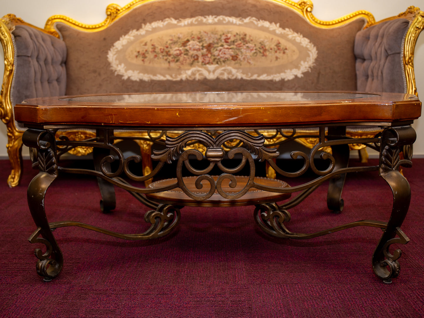 Ornate Oval Glass-Top Coffee Table with Iron Base