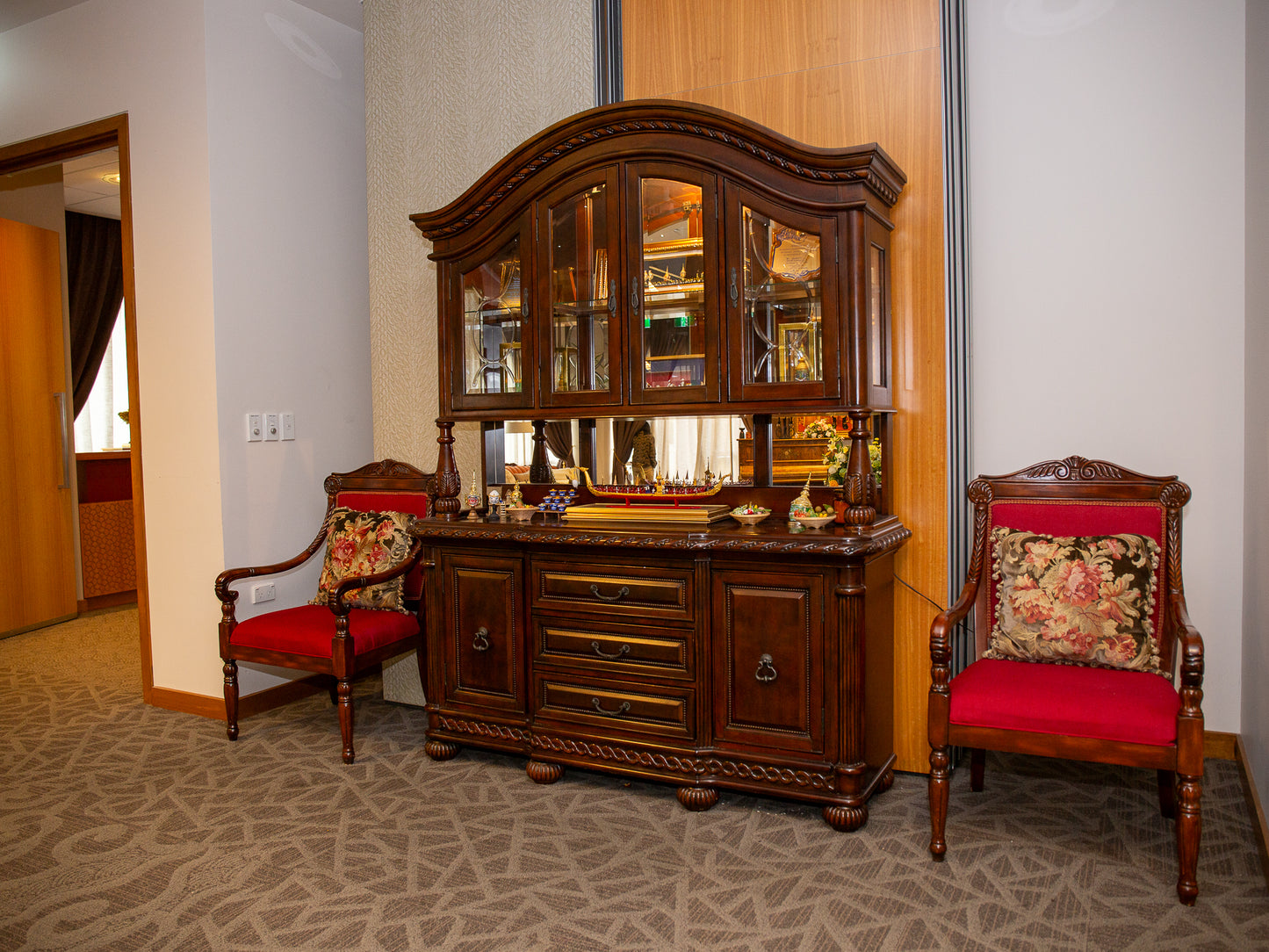 Ornate Wooden China Cabinet with Glass Display and Carved Detailing