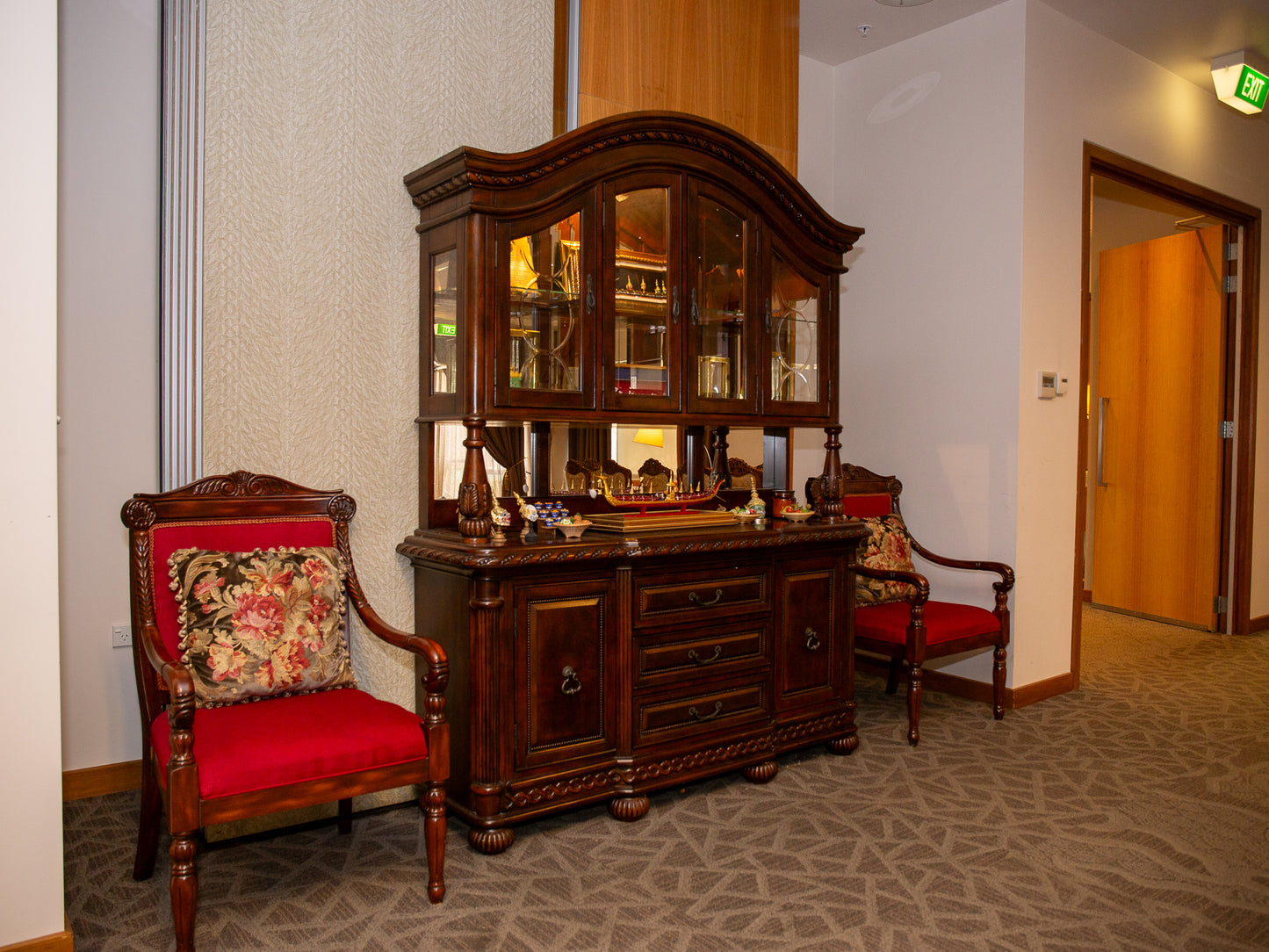 Ornate Wooden China Cabinet with Glass Display and Carved Detailing