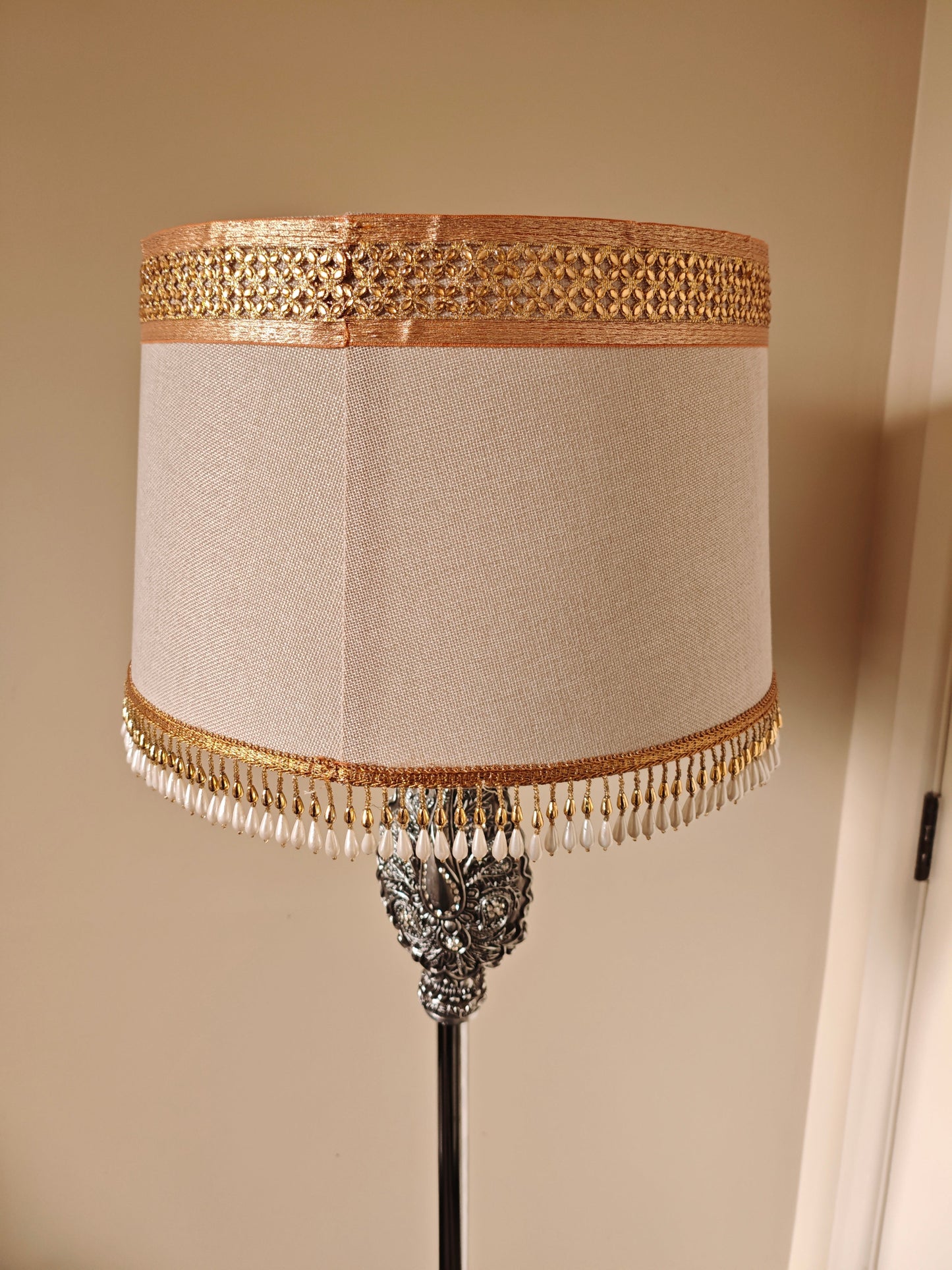 Elegant Silver Floor Lamp with Textured Shade and Ornate Detail